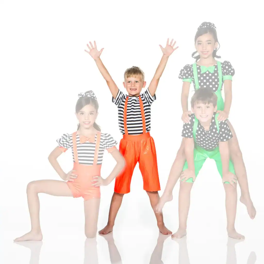 Four children in colorful striped and polka-dot costumes posing