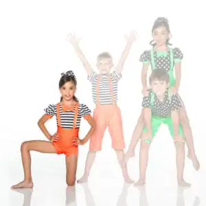 Four children in colorful striped and polka-dot costumes posing