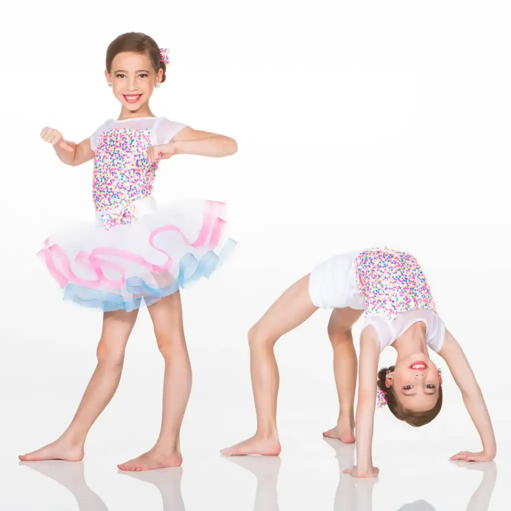 Young dancer in colorful costume posing and doing a backbend