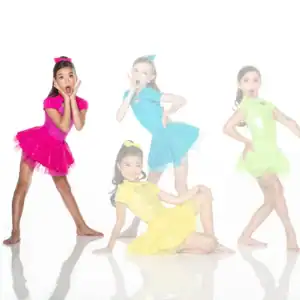 Four young dancers posing in colorful sequined costumes