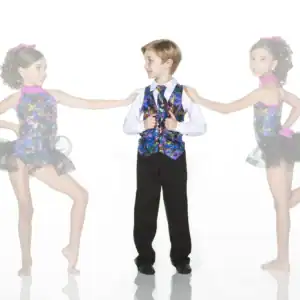Three children in colorful dance costumes pose together.