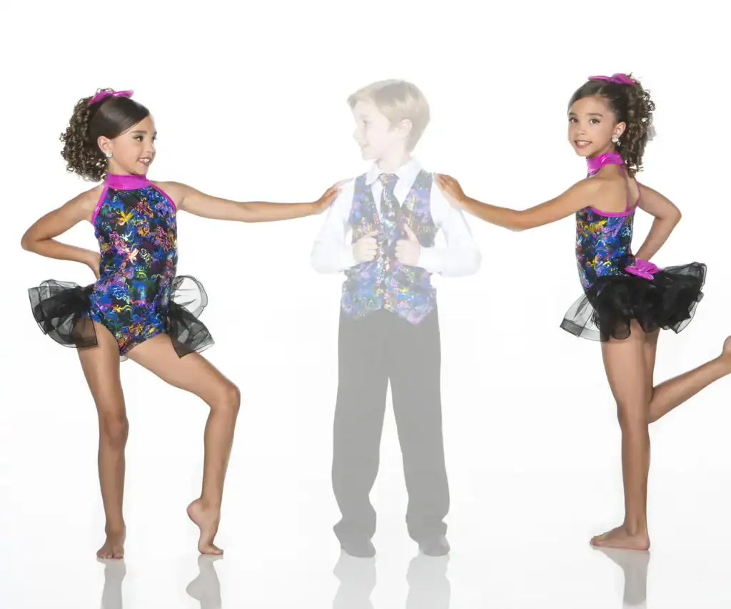 Two girls pose beside faded boy in matching dance costumes.