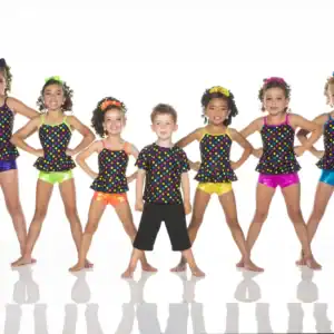 Seven children wearing colorful polka-dot dance costumes pose together.