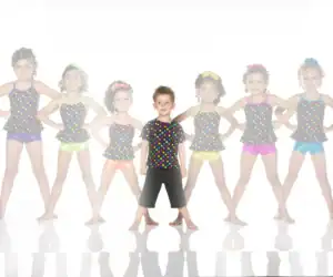 Young boy and girls in colorful polka-dot dance outfits