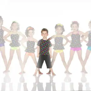 Young boy and girls in colorful polka-dot dance outfits