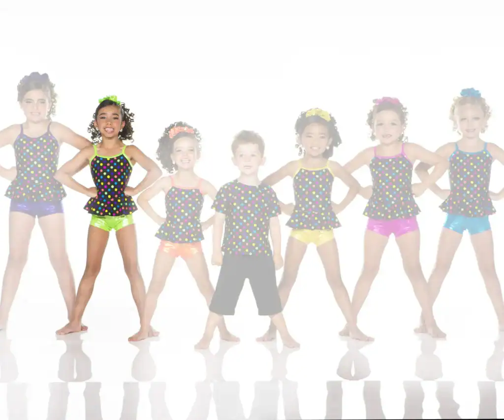 Seven children in colorful polka-dot dance costumes posing together