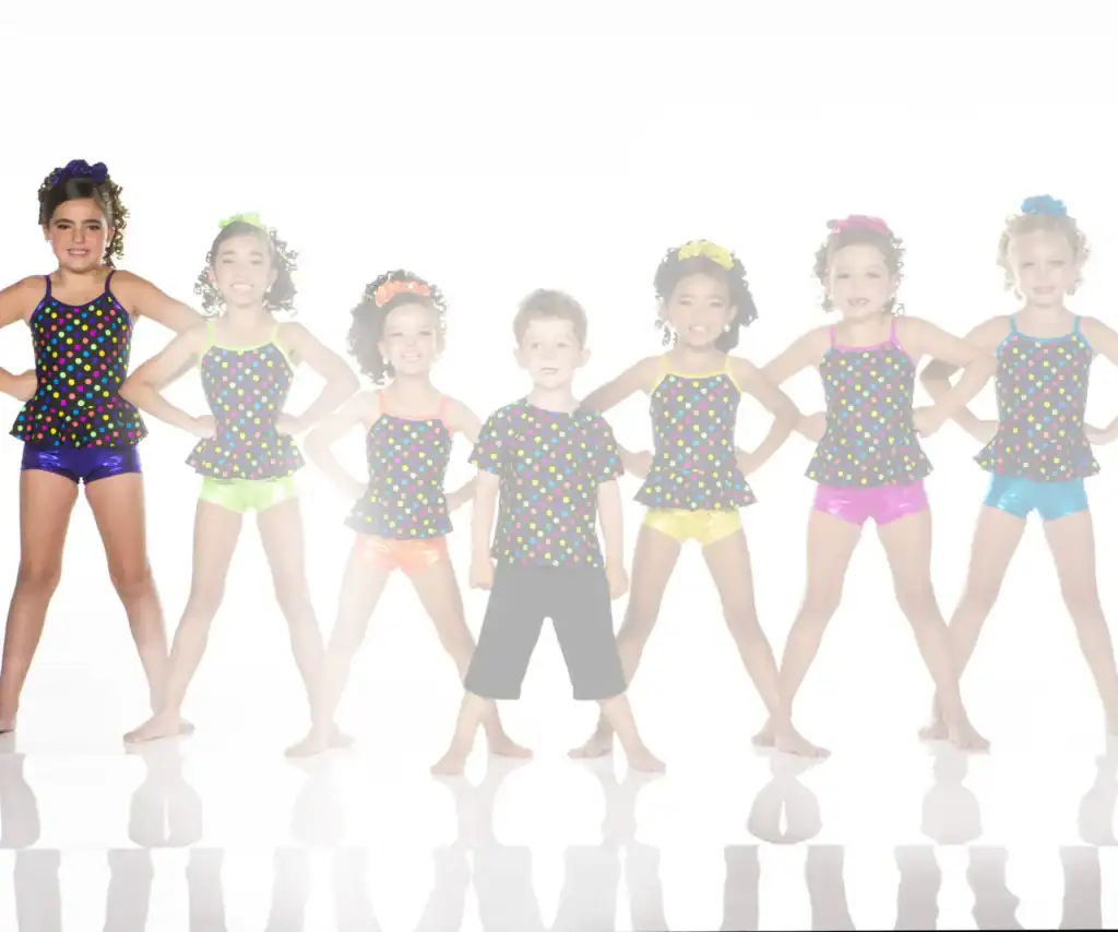 Children posing in colorful polka-dot dance costumes