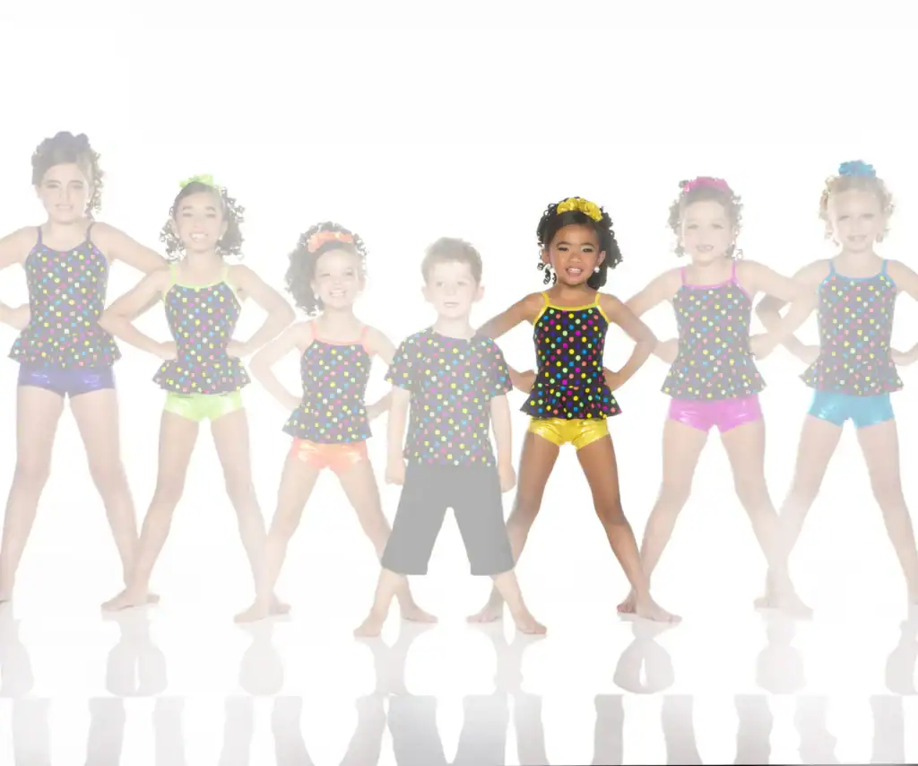 Seven children pose in colorful polka-dot dance outfits.