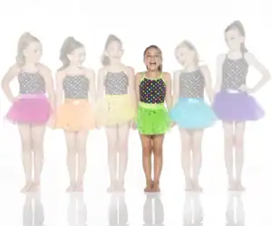 Six young dancers wearing colorful polka-dot leotards and tutus