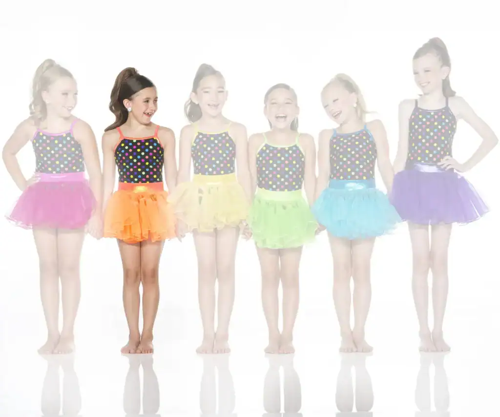 Six girls wearing colorful polka-dot dance costumes and tutus