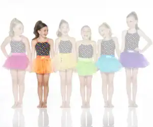 Six girls wearing colorful polka-dot dance costumes and tutus