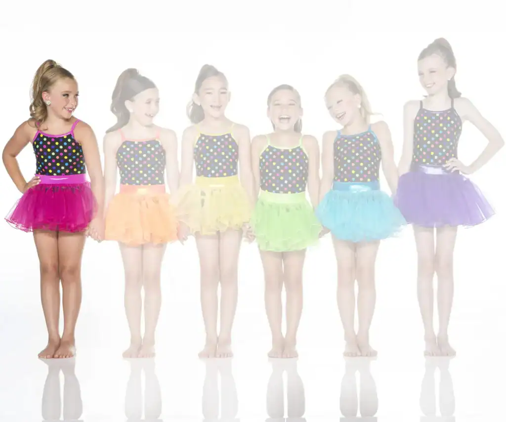 Six young dancers wearing colorful polka-dot tutus
