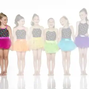 Six young dancers wearing colorful polka-dot tutus