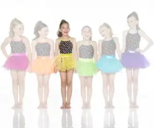 Six girls wearing colorful polka-dot dance costumes and tutus
