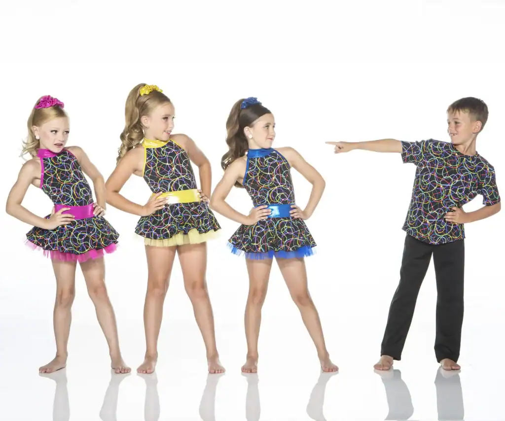 Four children wearing colorful patterned dance costumes