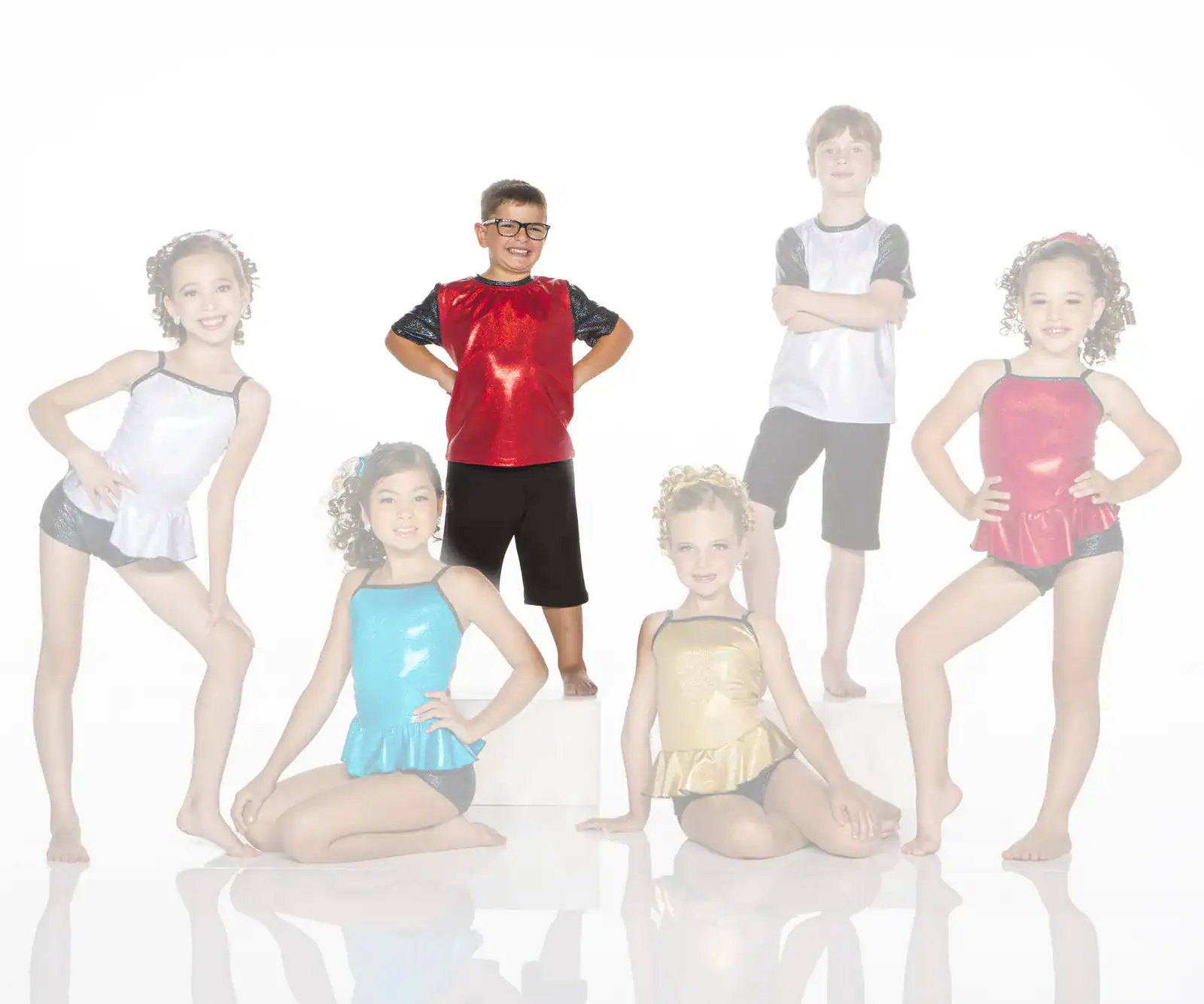 Six children posing in colorful dance costumes