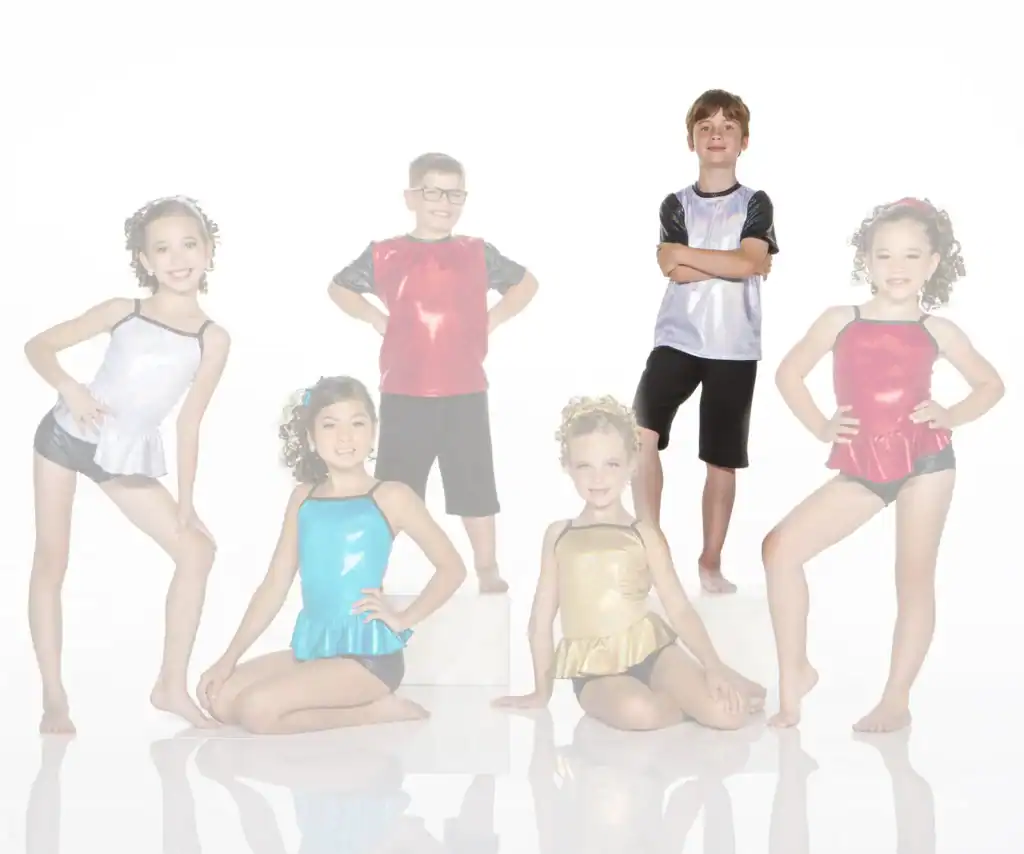 Six children posing in colorful shiny dance costumes