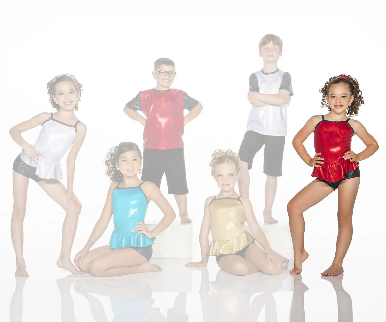 Six children pose in colorful dance costumes.
