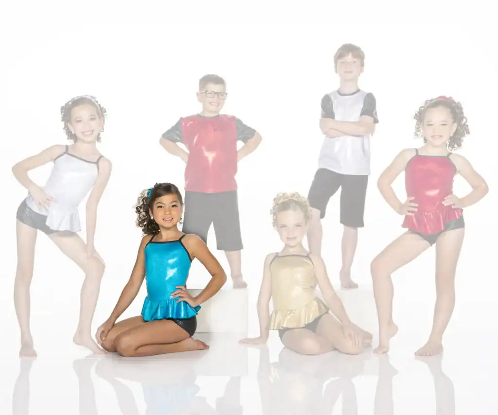 Six children wearing colorful dance costumes pose in a studio.