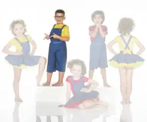 Children modeling colorful blue overall costumes