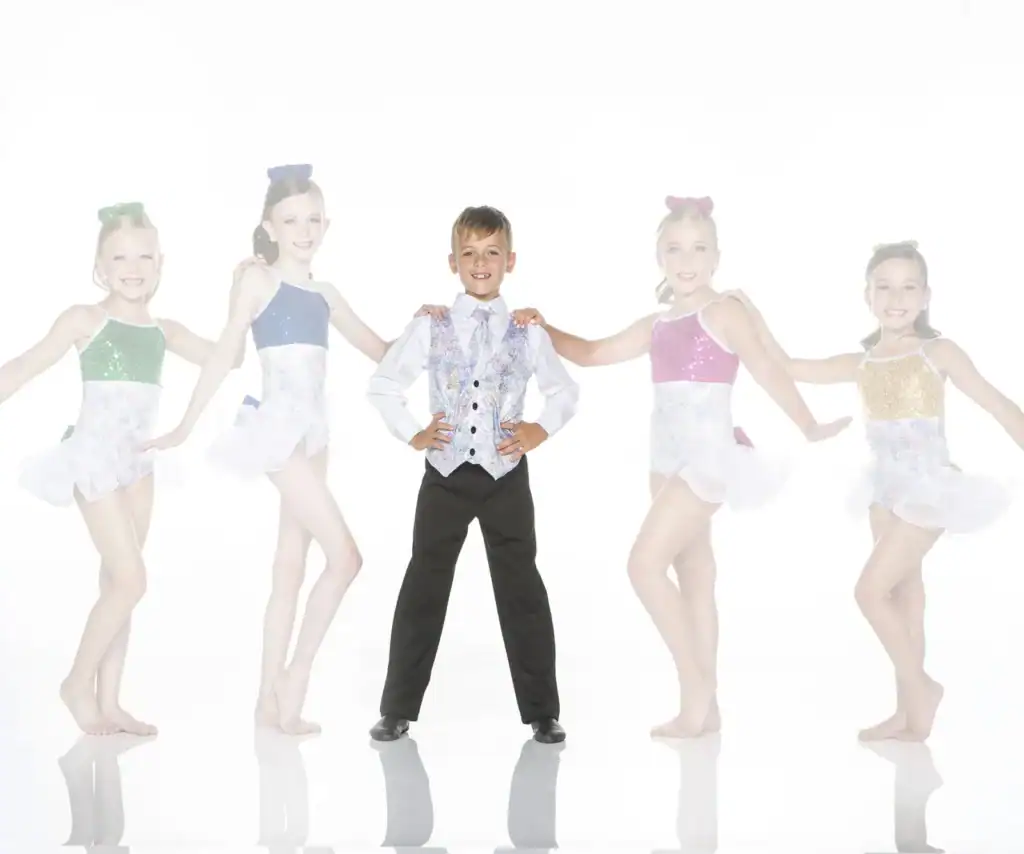 Five young dancers pose in colorful costumes on white background.