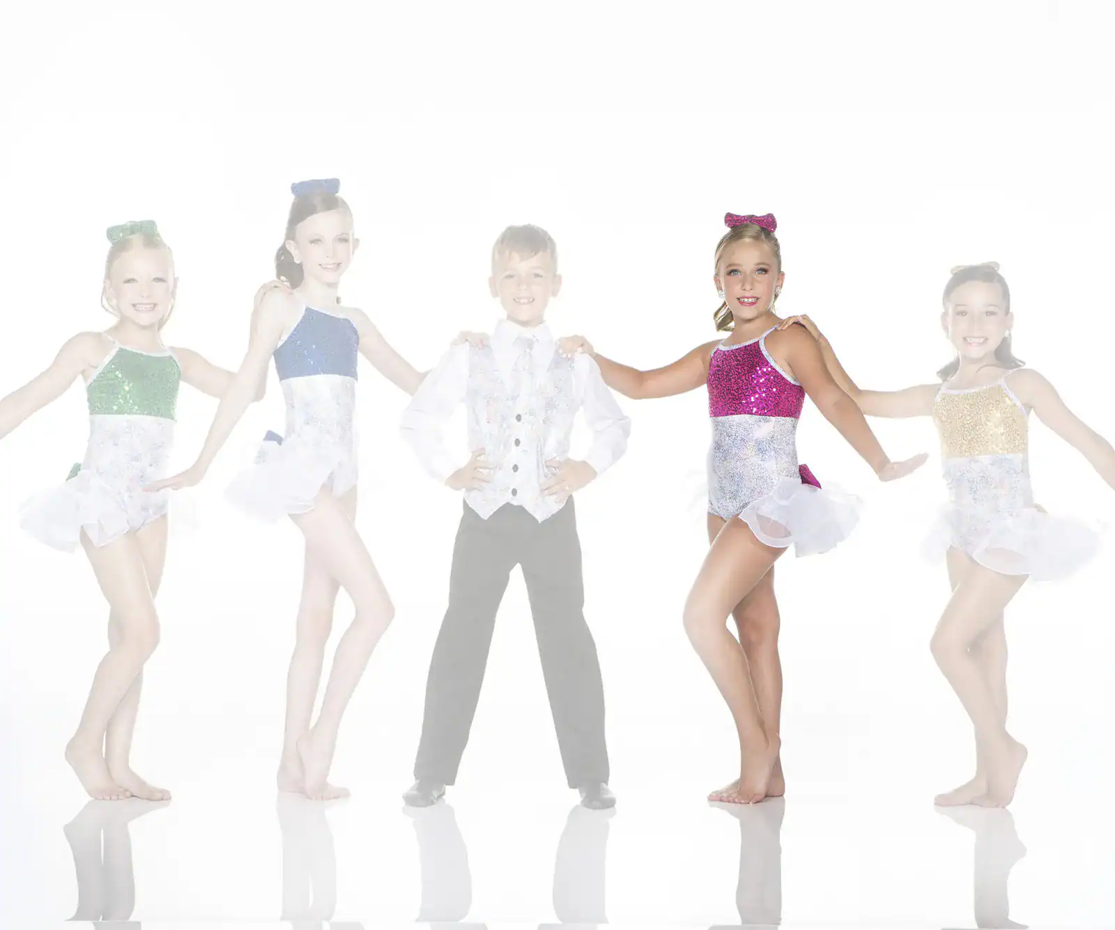 Five young dancers in colorful costumes posing together