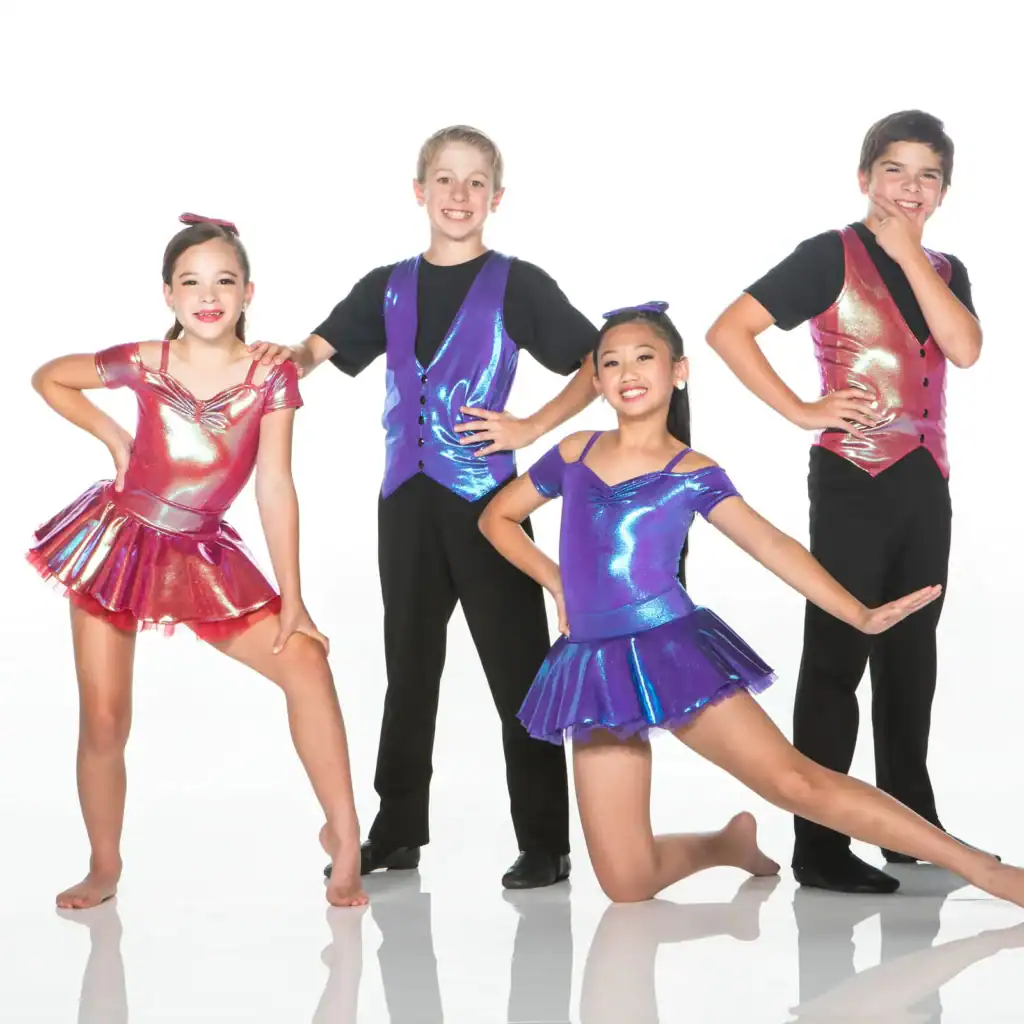 Four young dancers pose in colorful metallic costumes.