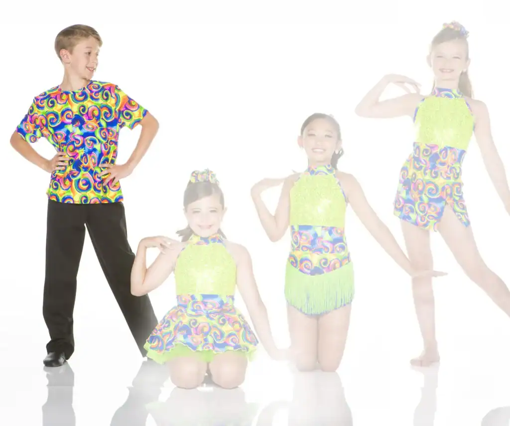 Four young dancers pose in colorful, patterned dance costumes.