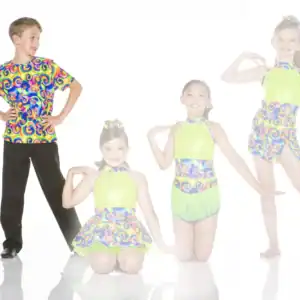 Four young dancers pose in colorful, patterned dance costumes.