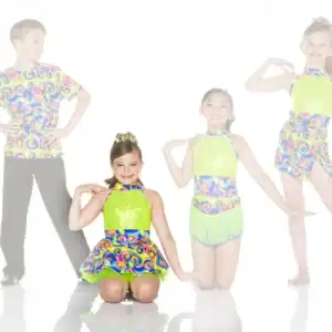 Four young dancers in colorful matching costumes posing together