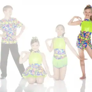 Four children pose in colorful dance costumes on white background.