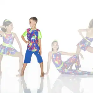 Children modeling colorful dance costumes against a white background
