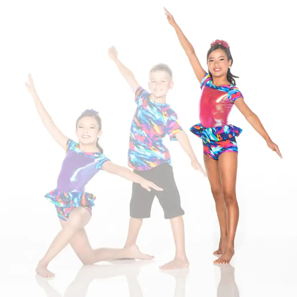 Three young dancers in colorful costumes posing against white background