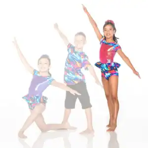 Three young dancers in colorful costumes posing against white background
