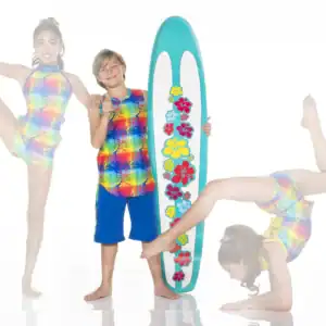 Children pose with floral surfboard in colorful swimwear