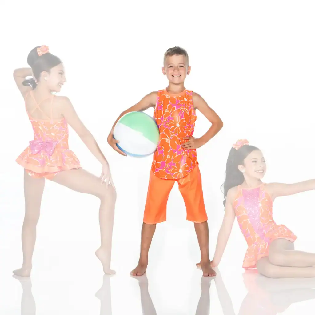 Three children modeling bright floral swimwear with beach ball