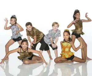 Five young dancers pose in animal-print costumes.
