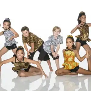Five young dancers pose in animal-print costumes.