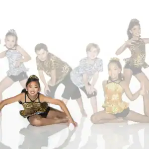 Six children pose in animal-print dance costumes.