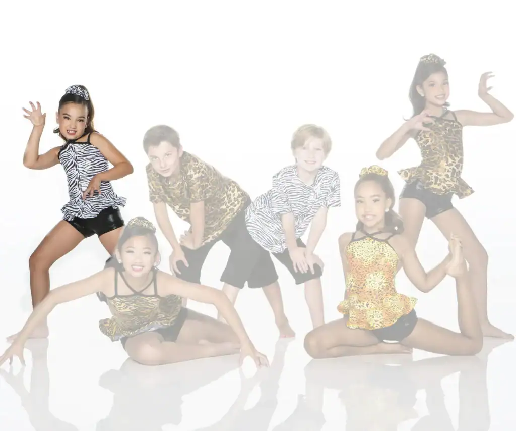 Five children pose in animal-print dance costumes.