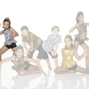 Five children pose in animal-print dance costumes.