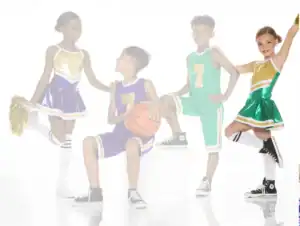 Four children in basketball uniforms and cheerleading outfits