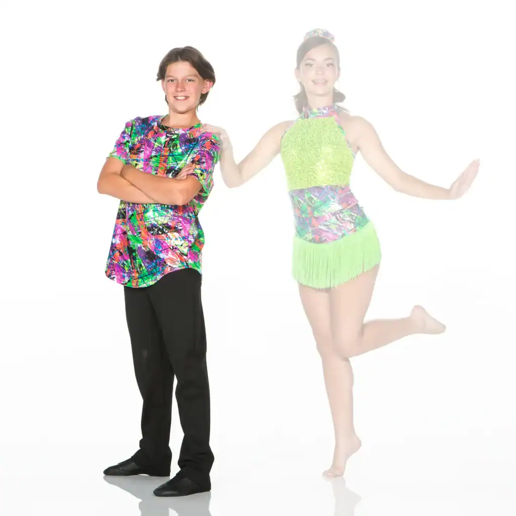 Two young dancers in colorful costumes pose against white background.