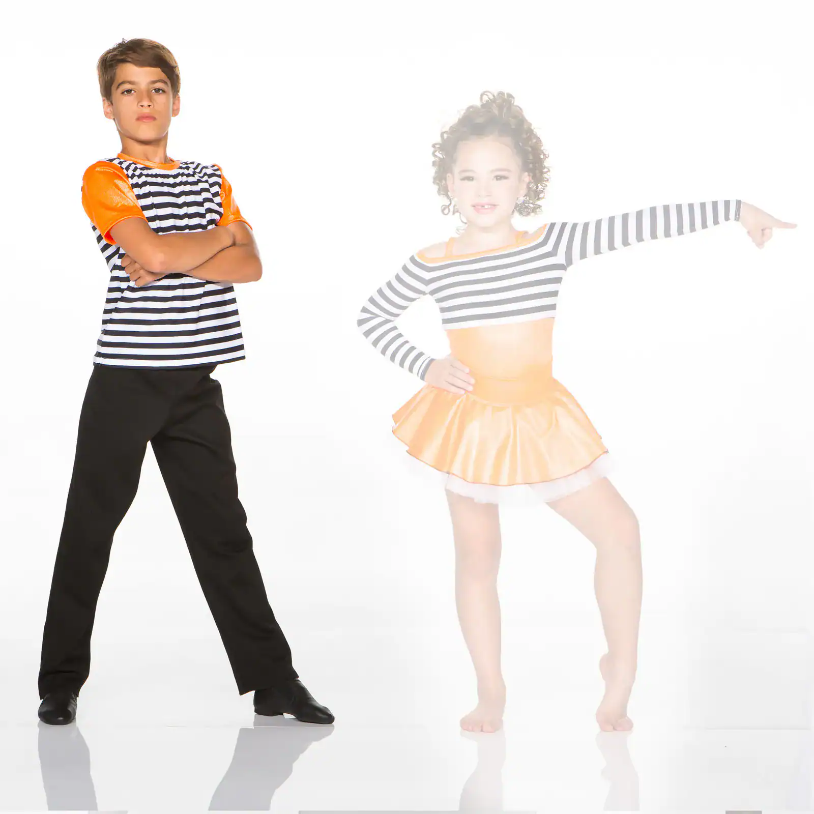 Two children posing in striped dance costumes