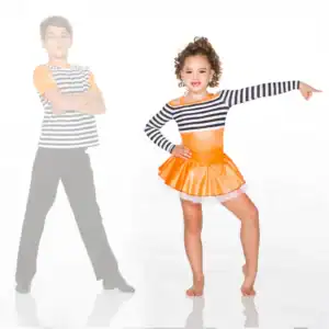 Girl in orange dance costume pointing beside boy