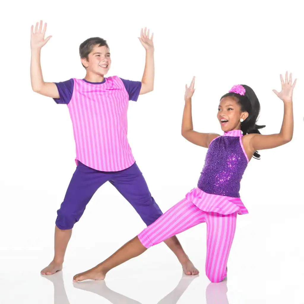 Two children dancing in bright pink and purple costumes