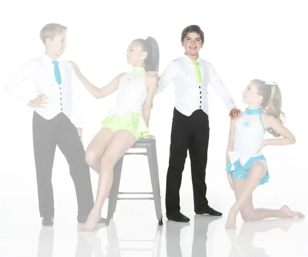 Four young dancers posing in colorful performance costumes