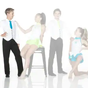 Four young dancers pose in colorful costumes against white background.