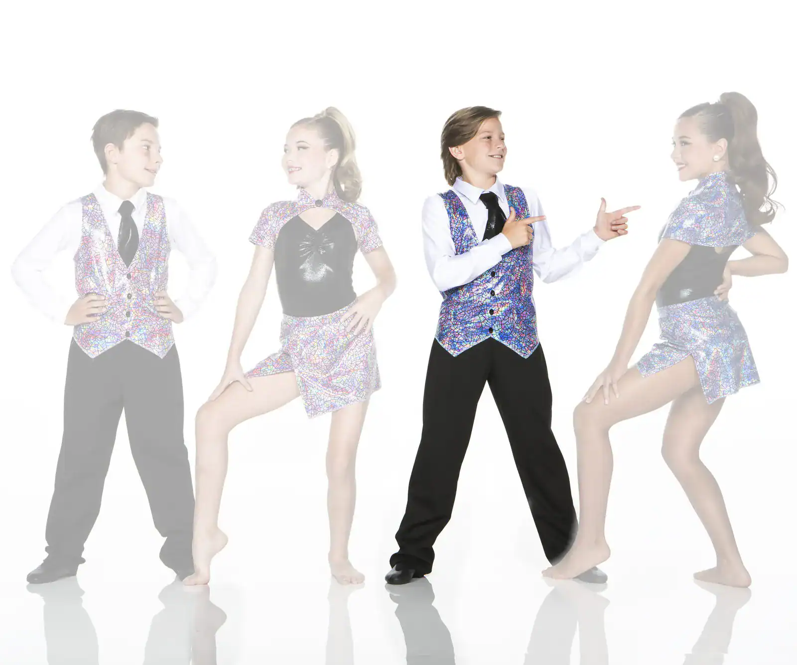 Four young dancers wearing colorful patterned performance costumes