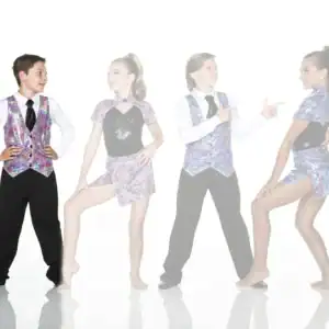Four young dancers wearing colorful mosaic-patterned costumes pose together.